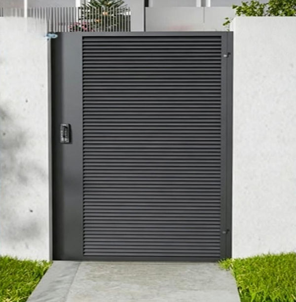 Black louvre pedestrian gate in a rendered wall