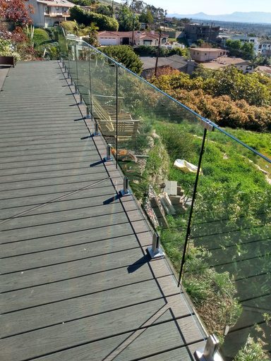 Glass on spigots along a sloping deck