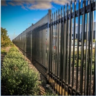 Black spear top security fence along a boundary