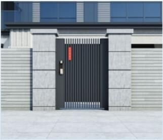 Black slat pedestrian gate set into a stone wall