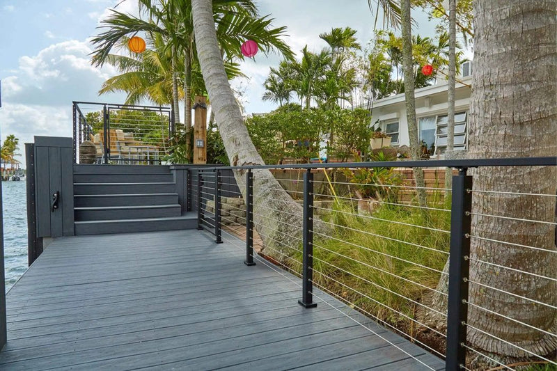 Black wire balustrade on a canal-front deck